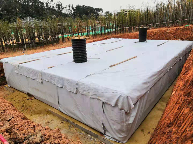 Rainwater Harvesting System wrapped with geotextile, 2 inspection wells installed.